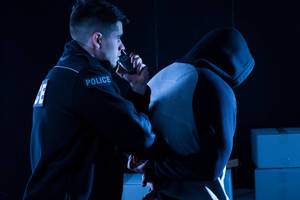 Carousel image 8e1fdbc508e5d4ea70cc mature policeman arresting law breaker at night