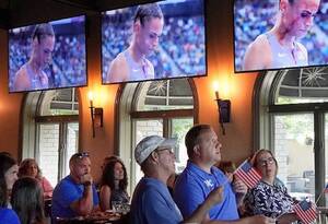 Carousel image 027648e8c005605272d4 best crop cfe0f12d709ff94877bf jim lambert and dr. jim reagan watch union catholic track legend sydney mclaughlin levrone race in the olympic semifinal for the 400m hurdles in paris.