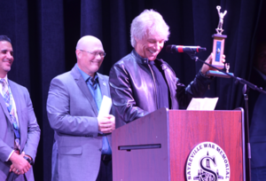 Carousel image 3f488c663fd5682342df best crop a286c9ba690a18e62a5f jon bon jovi holds up a second place trophy he won at a battle of the bands competition at sayreville high school  thk3067